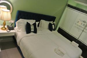 Postel nebo postele na pokoji v ubytování 1 Day Car Hotel Station 18