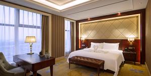 Ένα ή περισσότερα κρεβάτια σε δωμάτιο στο Chengdu Jin Yun Hotel
