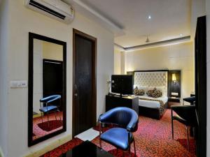 Posezení v ubytování Hotel Kohinoor Palace, Ludhiana