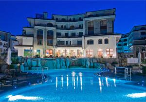 a large swimming pool in front of a building at Edmond Apartment-Highspeed-Internet-Free! in Aheloy