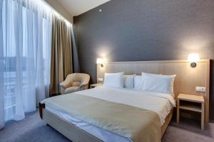 
Кровать или кровати в номере Отель Рига Ленд
