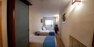 Postel nebo postele na pokoji v ubytování Hostal Ruiz + 8 fotografií