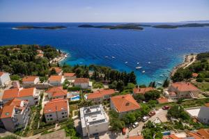 an aerial view of a town on the shore of a body of water at Pharia Hotel and Apartments - by the beach in Hvar