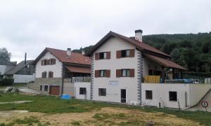 a house under construction with a building at Albergue Irugoienea in Espinal-Auzperri