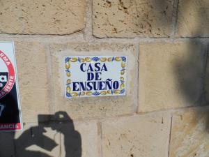 a sign that says casa de esuvino on a brick wall at Finca En Sueno de Son Jaumell in Cala Ratjada