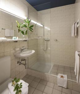 a bathroom with a shower and a sink at La Barca Blu in Locarno