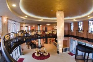 a spiral staircase in a building with a round ceiling at Edmond Apartment-Highspeed-Internet-Free! in Aheloy