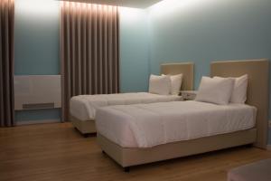 Postel nebo postele na pokoji v ubytování Feira Hostel & Suites