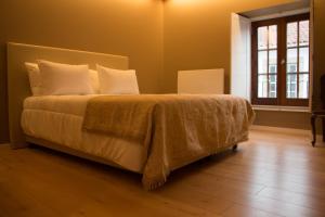 Postel nebo postele na pokoji v ubytování Feira Hostel & Suites