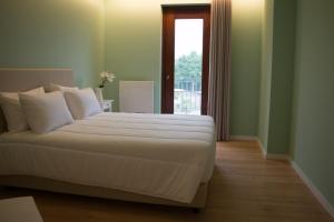 Postel nebo postele na pokoji v ubytování Feira Hostel & Suites