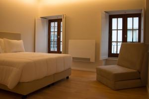 Postel nebo postele na pokoji v ubytování Feira Hostel & Suites