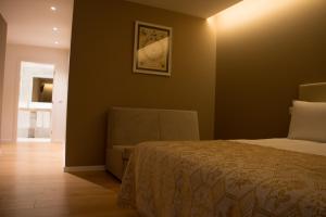 Postel nebo postele na pokoji v ubytování Feira Hostel & Suites