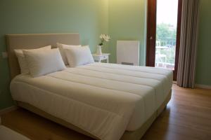 Postel nebo postele na pokoji v ubytování Feira Hostel & Suites