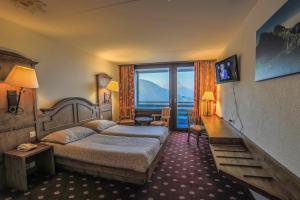 Postel nebo postele na pokoji v ubytování Hotel Central Résidence