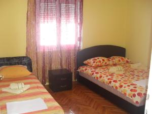 Posteľ alebo postele v izbe v ubytovaní Apartment Batricevic