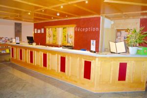 Ο χώρος του λόμπι ή της ρεσεψιόν στο Alpine Classic Hotel