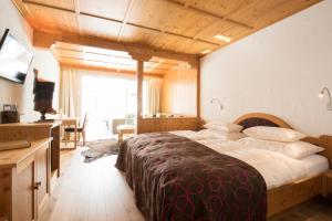 Postel nebo postele na pokoji v ubytování Boutiquehotel Grandau