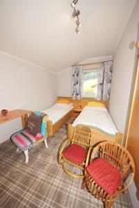 A bed or beds in a room at Pension Alexandra