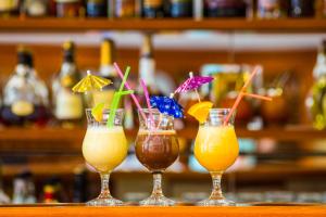 a group of four drinks sitting on a bar at Avalon in Syktyvkar