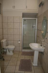 Ванная комната в De Vagebond Hotel-Pension