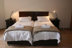 De Vagebond Hotel-Pension tesisinde bir odada yatak veya yataklar