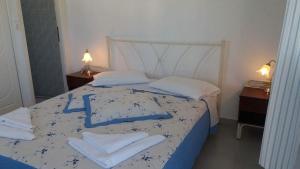 Ліжко або ліжка в номері Artemis Rooms