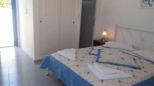 Ліжко або ліжка в номері Artemis Rooms