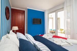 Posteľ alebo postele v izbe v ubytovaní Luxury apartment Loreta