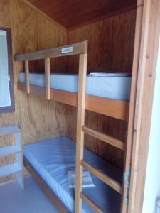 a couple of bunk beds in a cabin at Aire Du Verger in Palluau