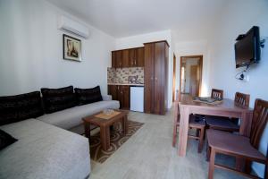 a living room with a couch and a table at Kollari Apartments in Ulcinj