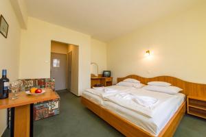 Posteľ alebo postele v izbe v ubytovaní Hotel Nostra