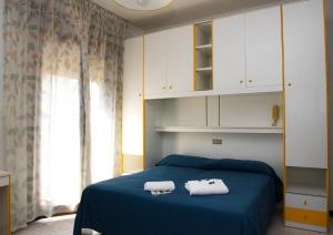 Postel nebo postele na pokoji v ubytování Hotel Malibran
