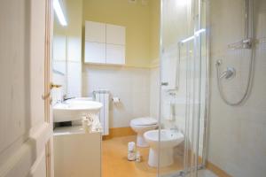 a bathroom with a toilet and a sink and a shower at Residence Viviverde in Terni