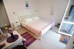 Postel nebo postele na pokoji v ubytování Rooms Feme