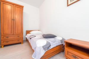 Postel nebo postele na pokoji v ubytování Apartments Miro