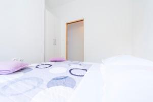 Postel nebo postele na pokoji v ubytování Apartments Miro