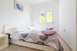 Postel nebo postele na pokoji v ubytování Apartments Miro