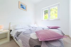 Postel nebo postele na pokoji v ubytování Apartments Miro