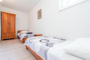 Postel nebo postele na pokoji v ubytování Apartments Miro