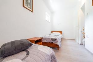 Postel nebo postele na pokoji v ubytování Apartments Miro