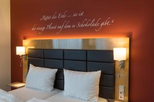 Postel nebo postele na pokoji v ubytování Das Schokoladenhotel