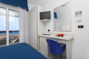 TV a/nebo společenská místnost v ubytování Hotel Oriente