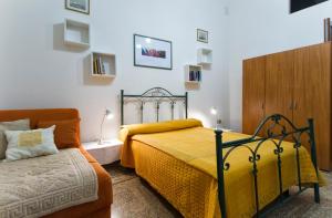 מיטה או מיטות בחדר ב-Affittacamere Zahra