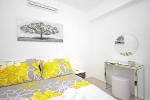 a bedroom with a bed and a desk with a tree at "NM" Luxury apartments in Split