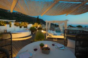 a patio with a table and a gazebo at Hotel Villa Blu Capri in Anacapri