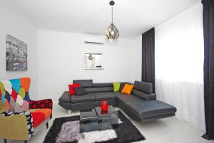 a living room with a couch and a chair at "NM" Luxury apartments in Split