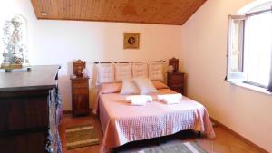 a bedroom with a bed with two towels on it at Appartamenti Liberty in Erice