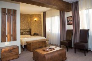 Ένα ή περισσότερα κρεβάτια σε δωμάτιο στο La Bucovineanca