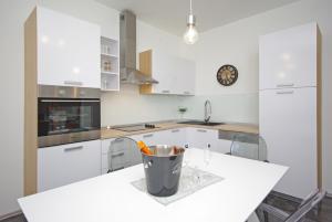 a white kitchen with a trash can on a counter at "NM" Luxury apartments in Split