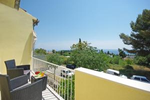a balcony with chairs and a view of a parking lot at "NM" Luxury apartments in Split